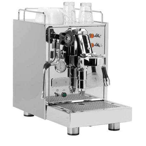 A compact stainless steel espresso machine with a pressure gauge, shown from the side.