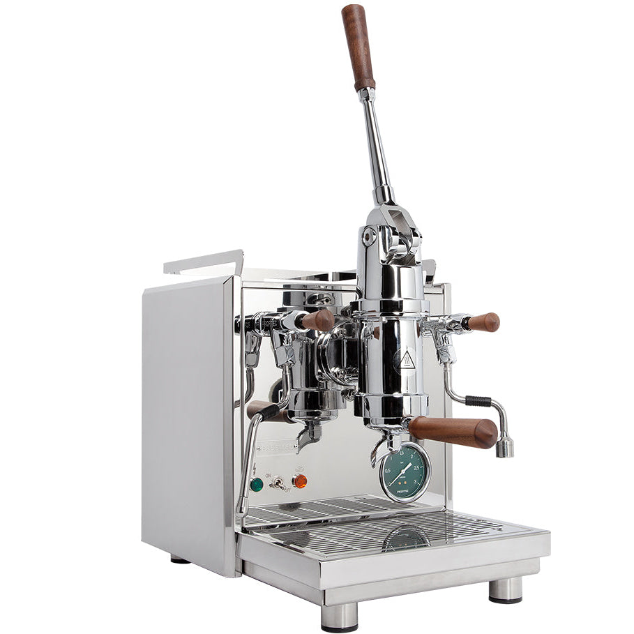 A lever espresso machine with a tall chrome body, a long hand lever and walnut handles, shown from the front.