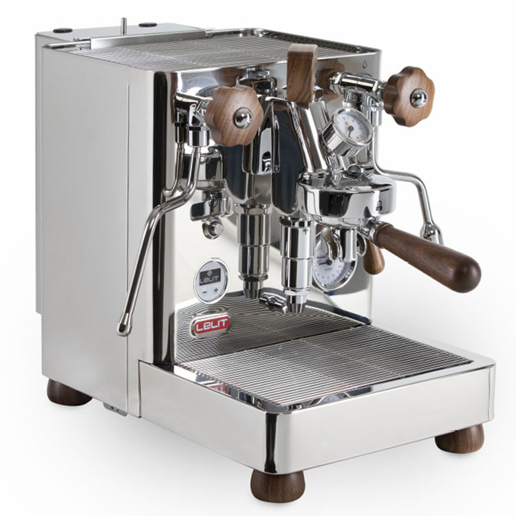 A stainless steel dual-boiler espresso machine with a wooden paddle lever on the group head, shown from the front.